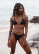 Make a statement with metal ring details. The Honëlo Tease Bikini offers an adjustable, flattering fit.