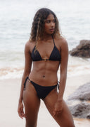 Make a statement with metal ring details. The Honëlo Tease Bikini offers an adjustable, flattering fit.