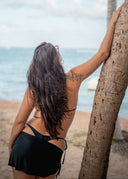 A minimal beach sarong designed for effortless styling over your bikini. The must-have accessory to complete your vacation look.
