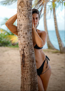 A minimal triangle bikini elevated with sleek ring details. The Essential Bikini offers an adjustable fit and a clean summer silhouette.