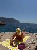 Honëlo Beach Day Cap in Butter worn at the beach